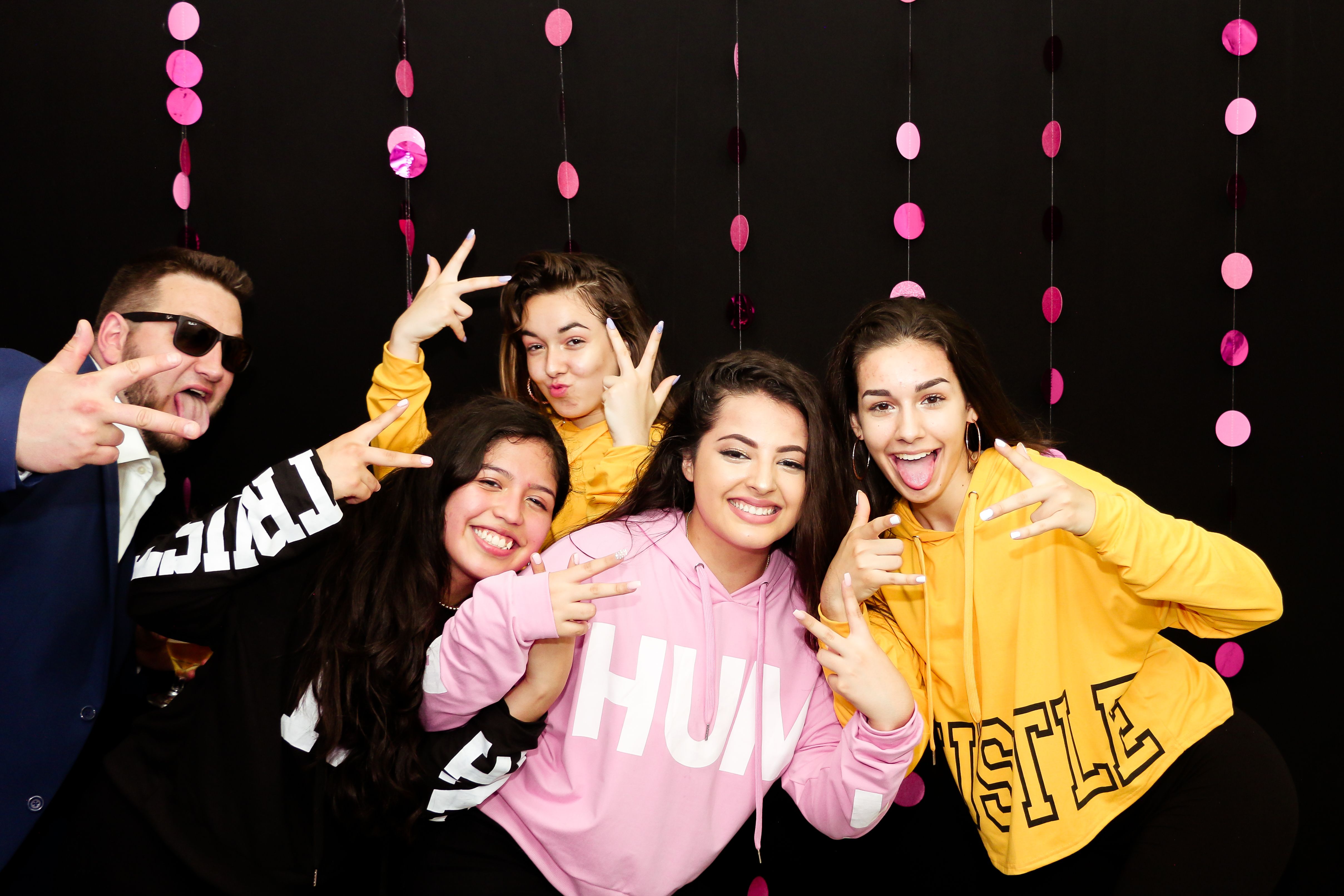Friends having fun at The Photo Fun photobooth